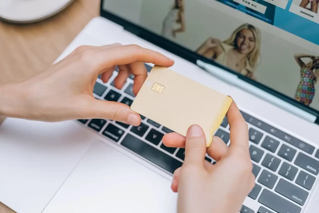 Brand Equity Building Increased Sales and Pricing Power. Woman Holding Credit Card.